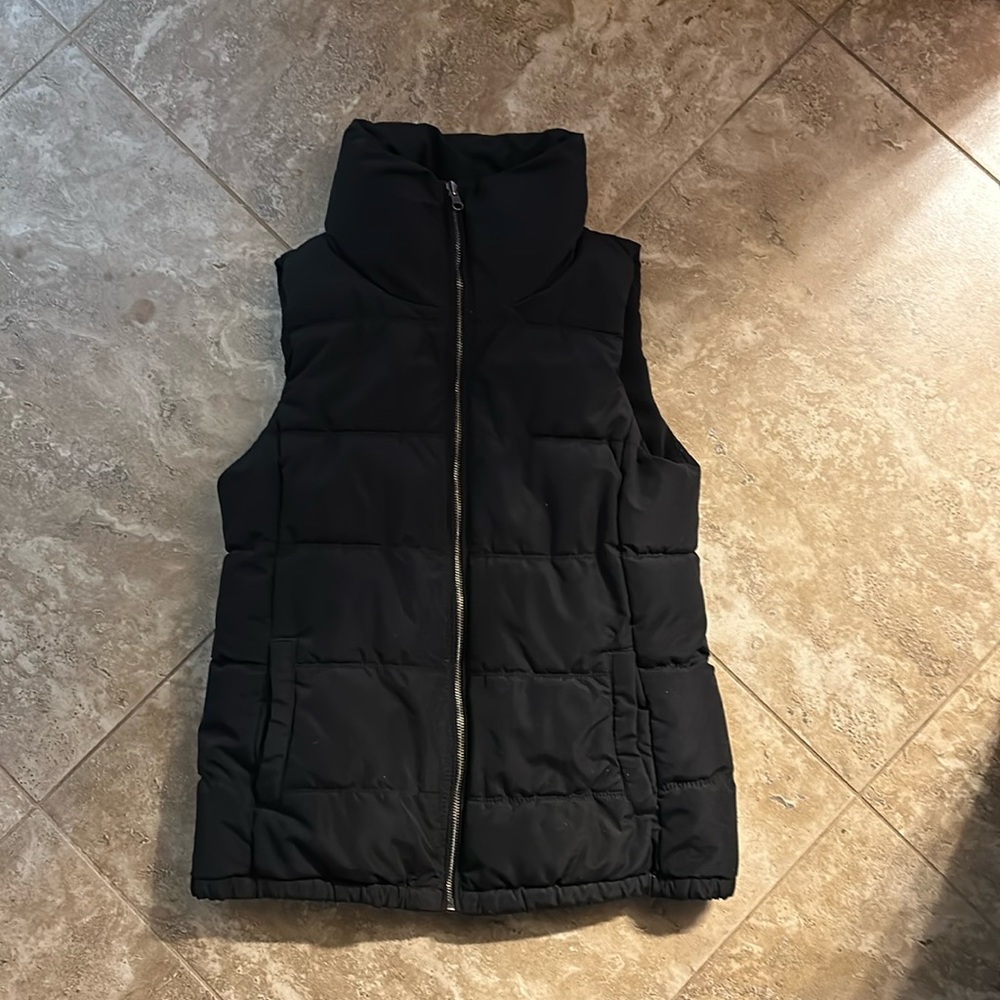 Old navy black vest. Has pockets. Soft in side. Very warm!